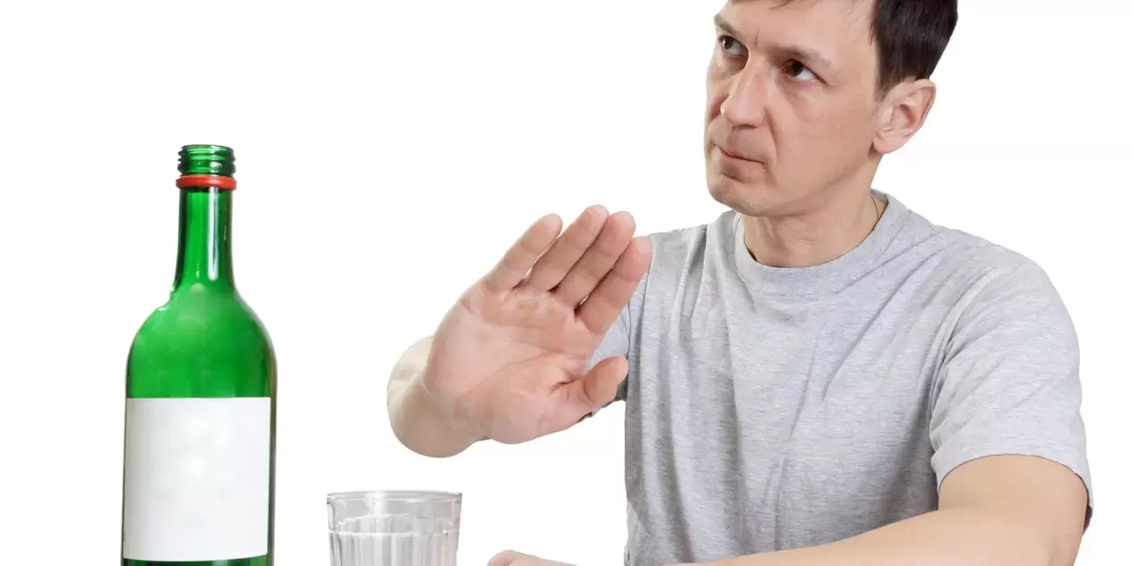 A man refuses alcohol